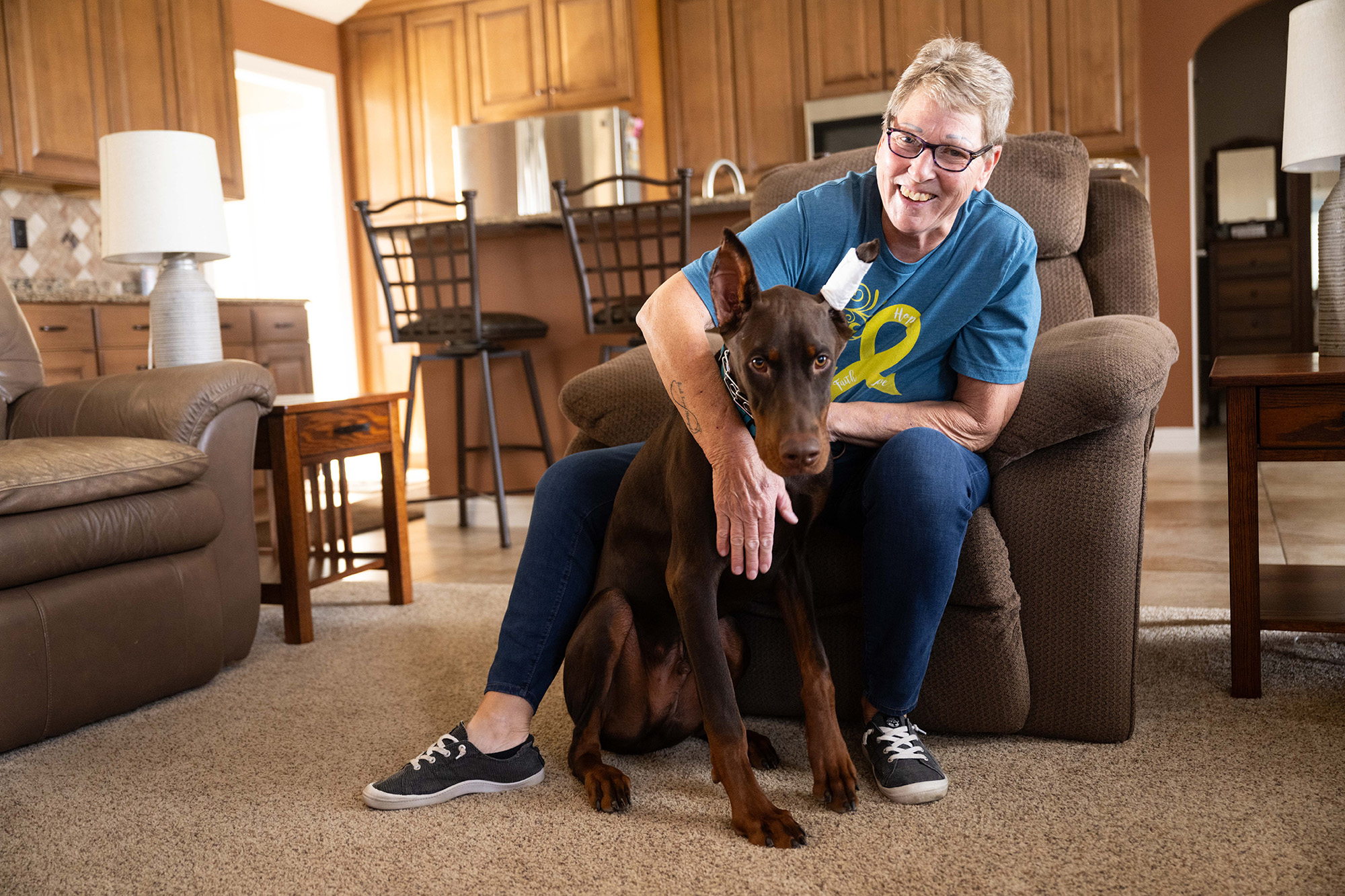 Linda Jacobs sitting with her new puppy